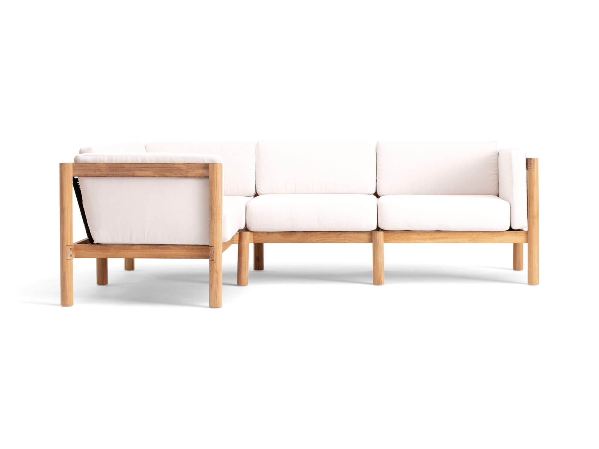 Front view of 4-piece outdoor sectional with white arm cushions